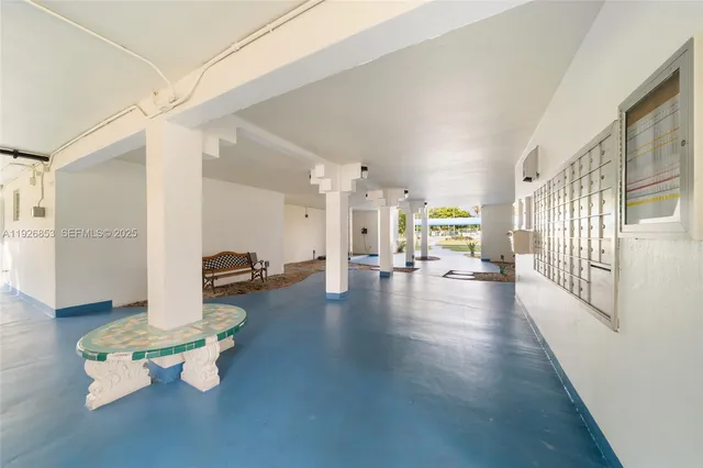 a lobby with furniture and floor to ceiling window