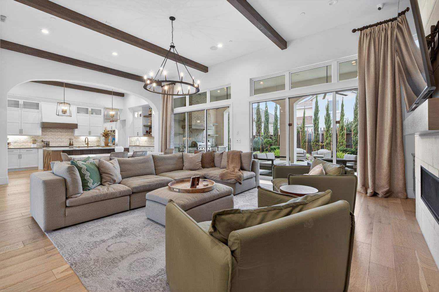 61 Secret Court Lodi, CA 95242 - Photo 11 of 79 a living room with furniture ceiling fan and a window