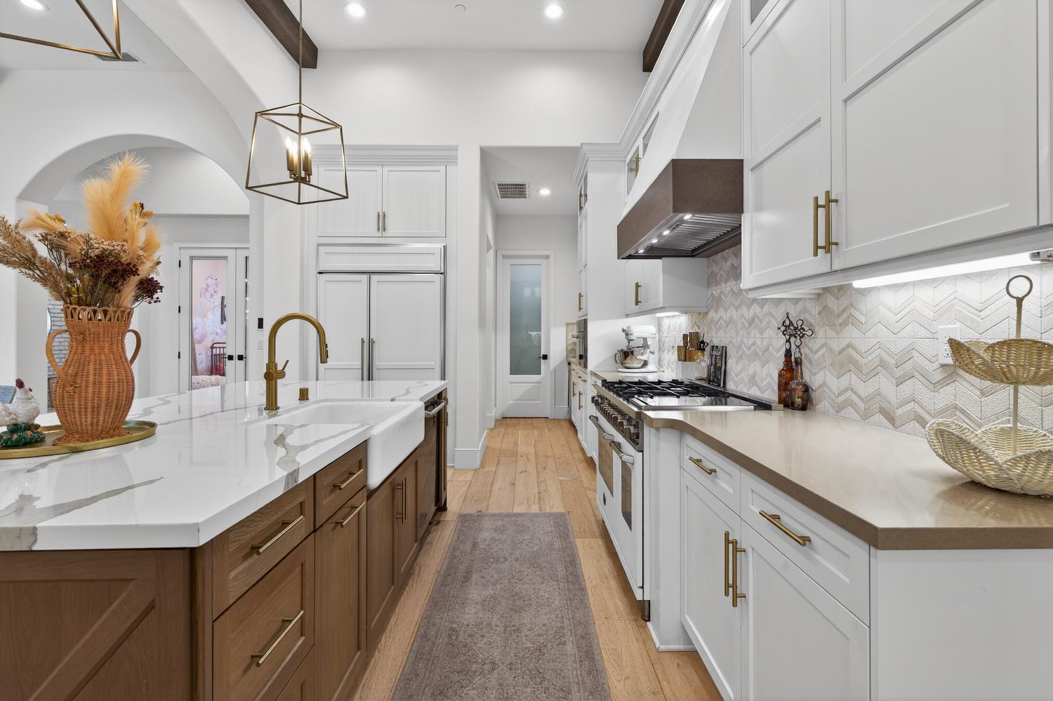 61 Secret Court Lodi, CA 95242 - Photo 14 of 79 a kitchen with cabinets a sink and stainless steel appliances