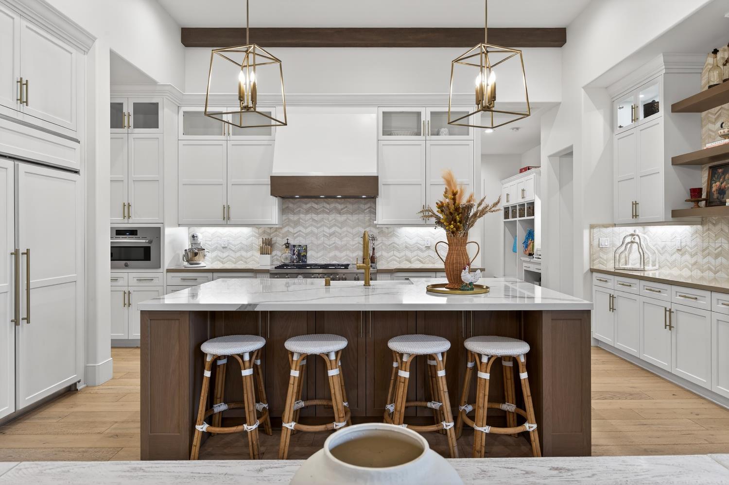 61 Secret Court Lodi, CA 95242 - Photo 15 of 79 a kitchen with cabinets and chairs