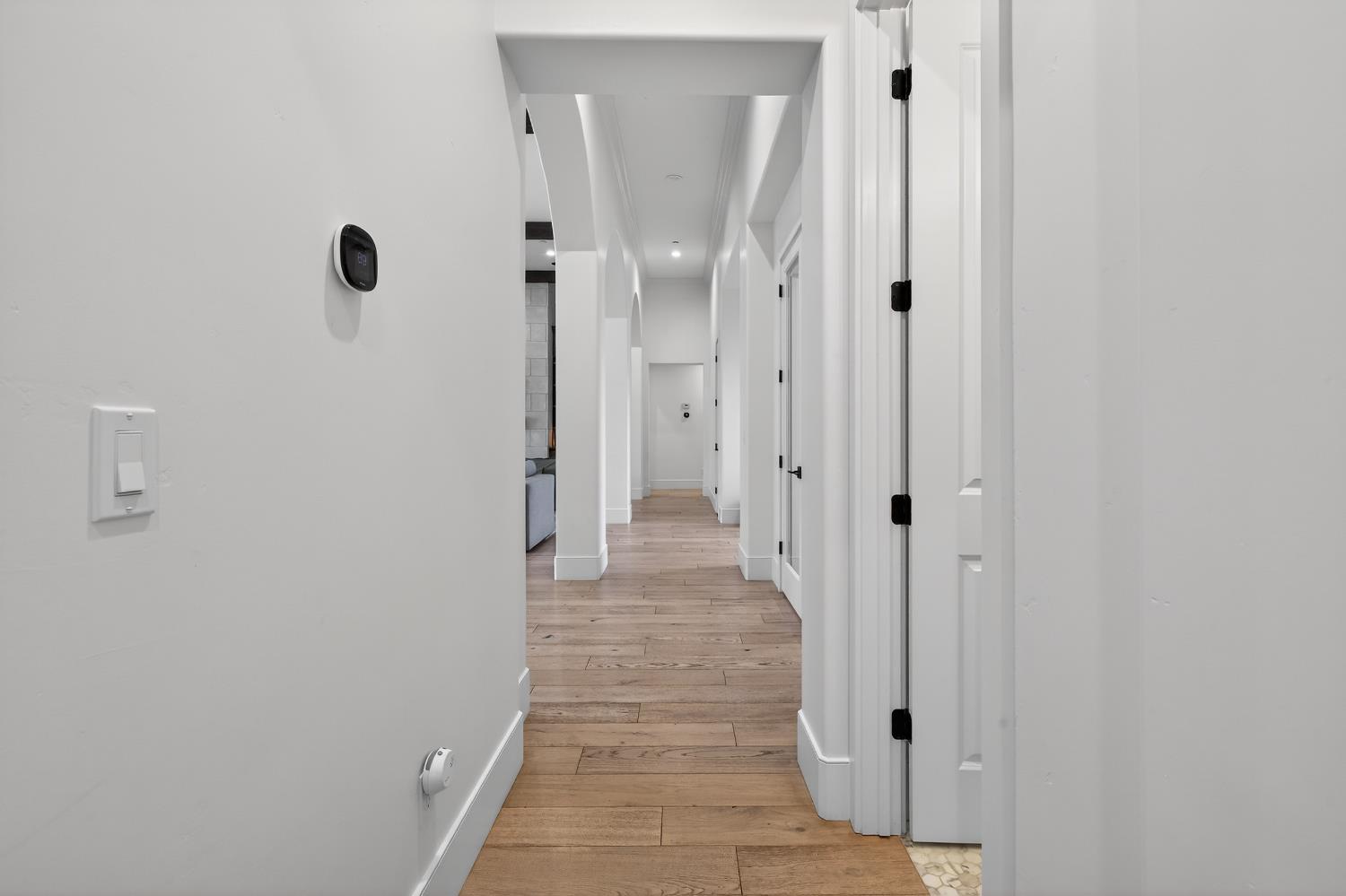 61 Secret Court Lodi, CA 95242 - Photo 22 of 79 a view of a hallway with wooden floor and a glass door