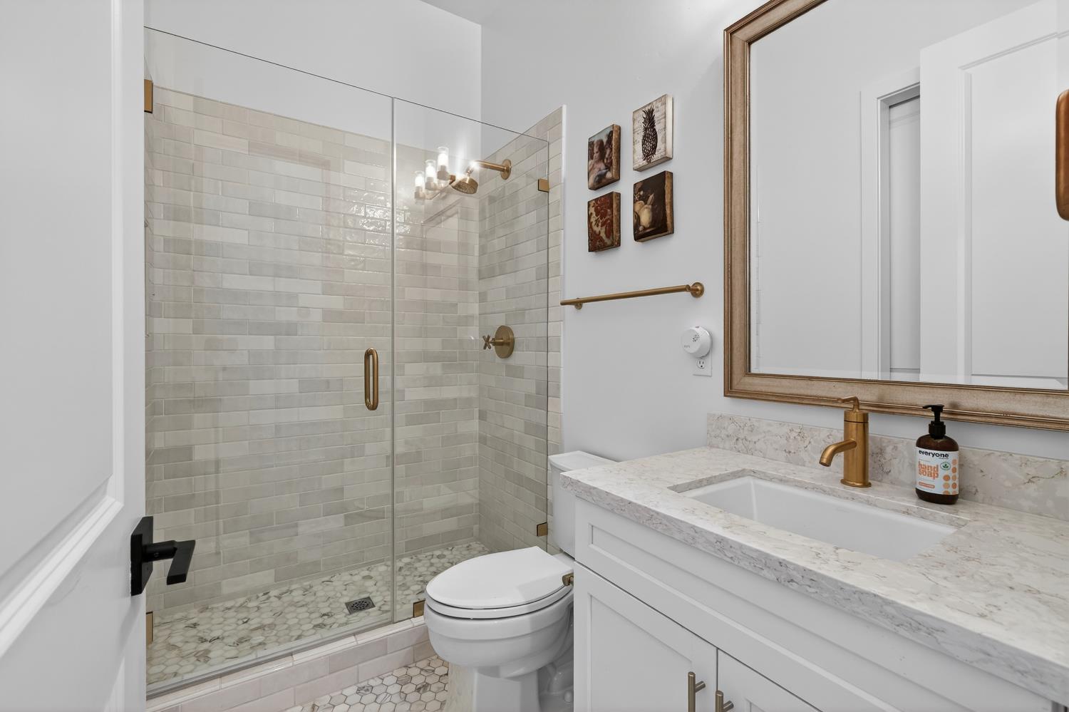 61 Secret Court Lodi, CA 95242 - Photo 23 of 79 a bathroom with a sink a toilet and shower