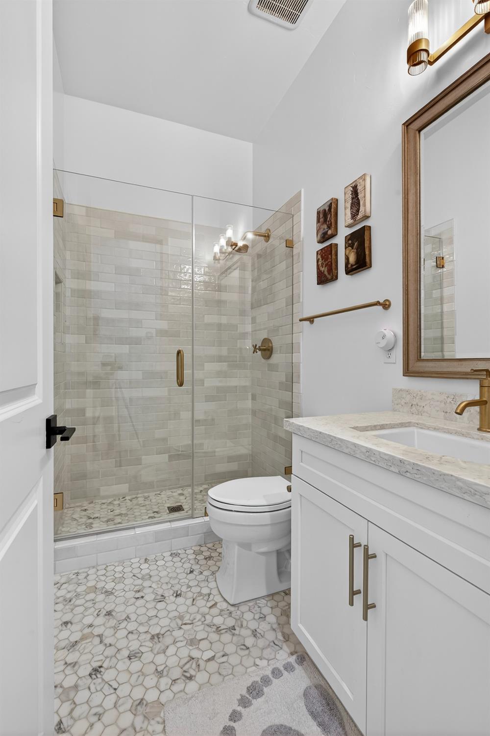 61 Secret Court Lodi, CA 95242 - Photo 24 of 79 a bathroom with a sink a toilet and shower