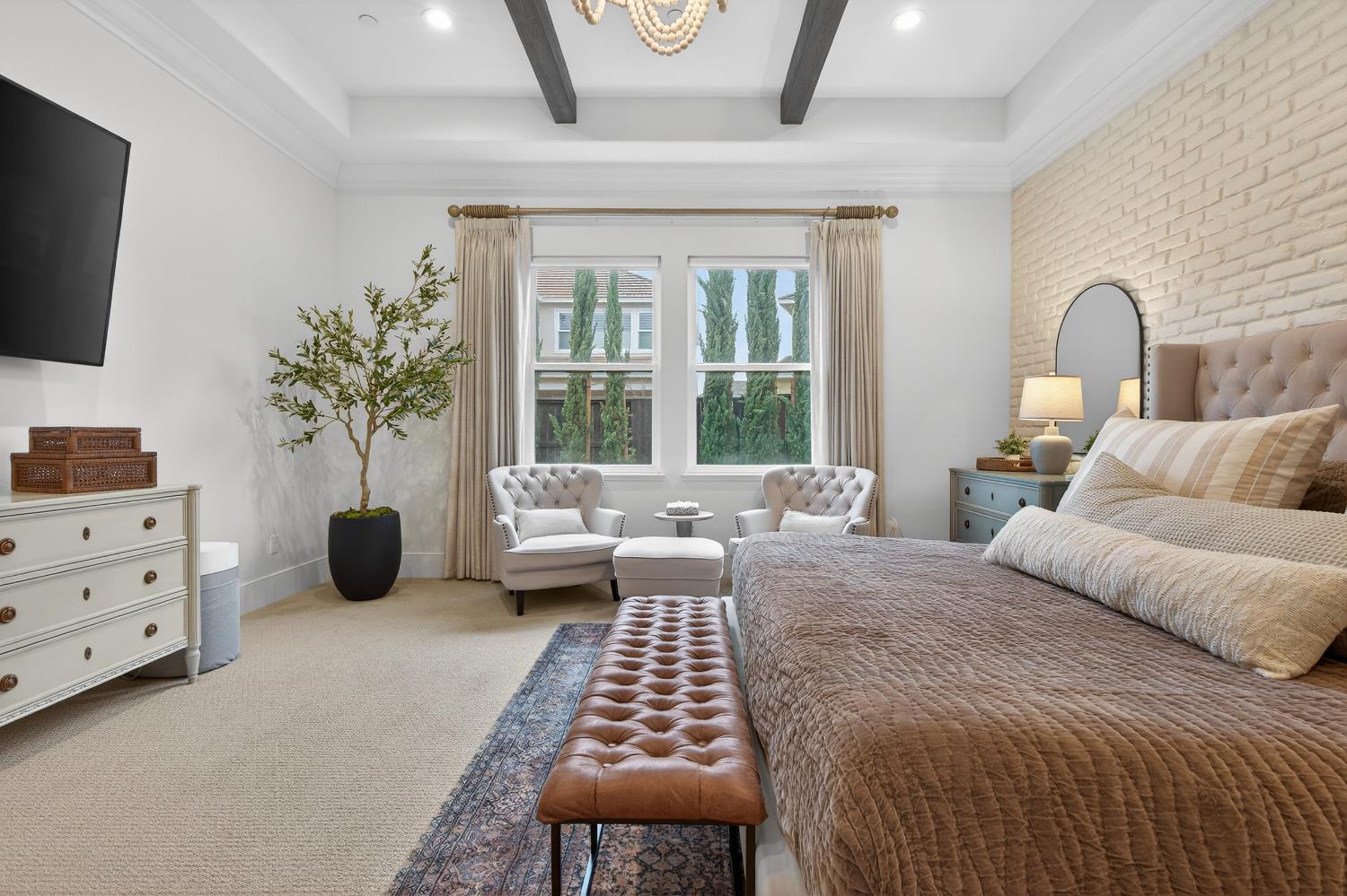 61 Secret Court Lodi, CA 95242 - Photo 33 of 79 a bedroom with a large bed and a window