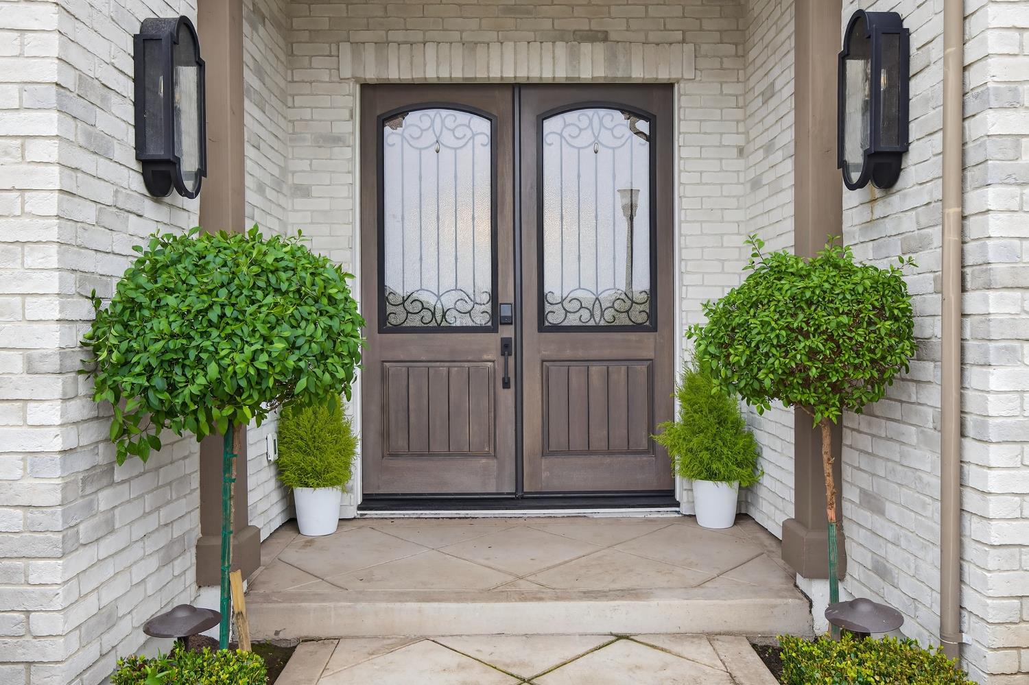 61 Secret Court Lodi, CA 95242 - Photo 4 of 79 a couple of potted plants in front of door
