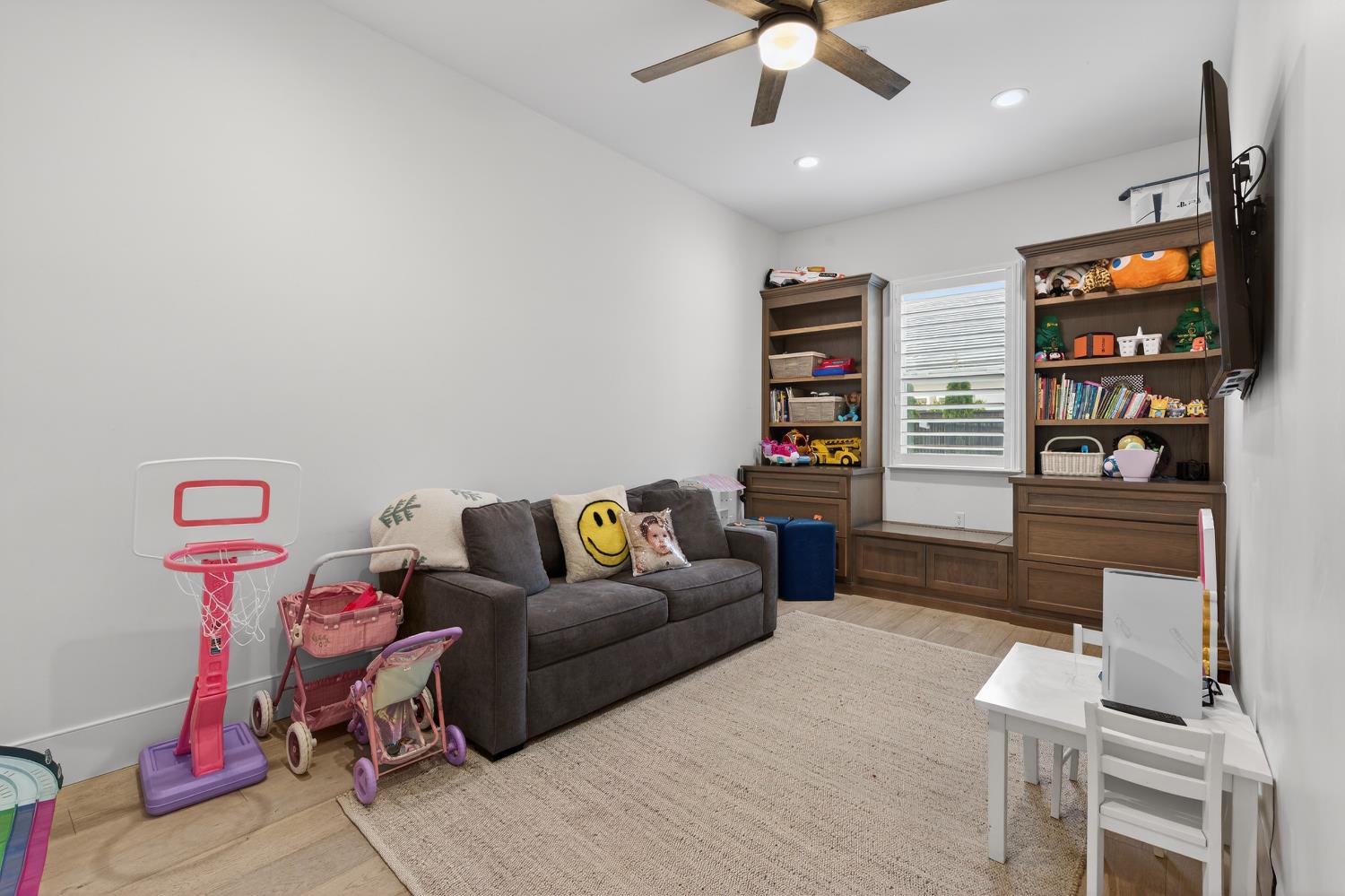 61 Secret Court Lodi, CA 95242 - Photo 42 of 79 a living room with furniture a window and a flat screen tv