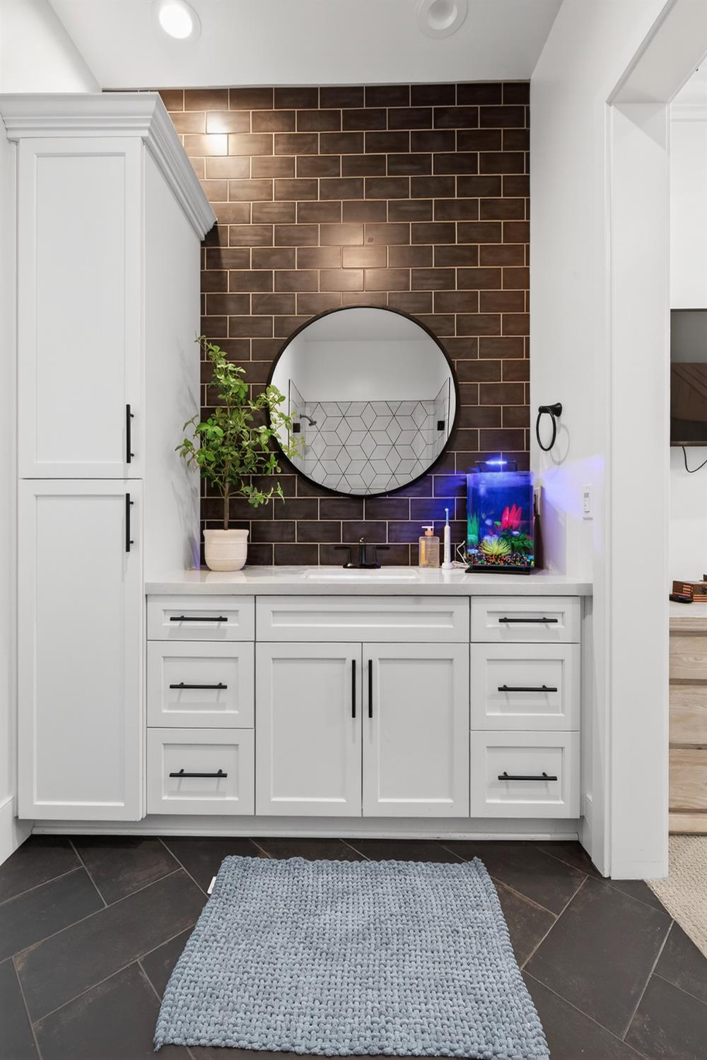 61 Secret Court Lodi, CA 95242 - Photo 50 of 79 a bathroom with a toilet a sink and a mirror