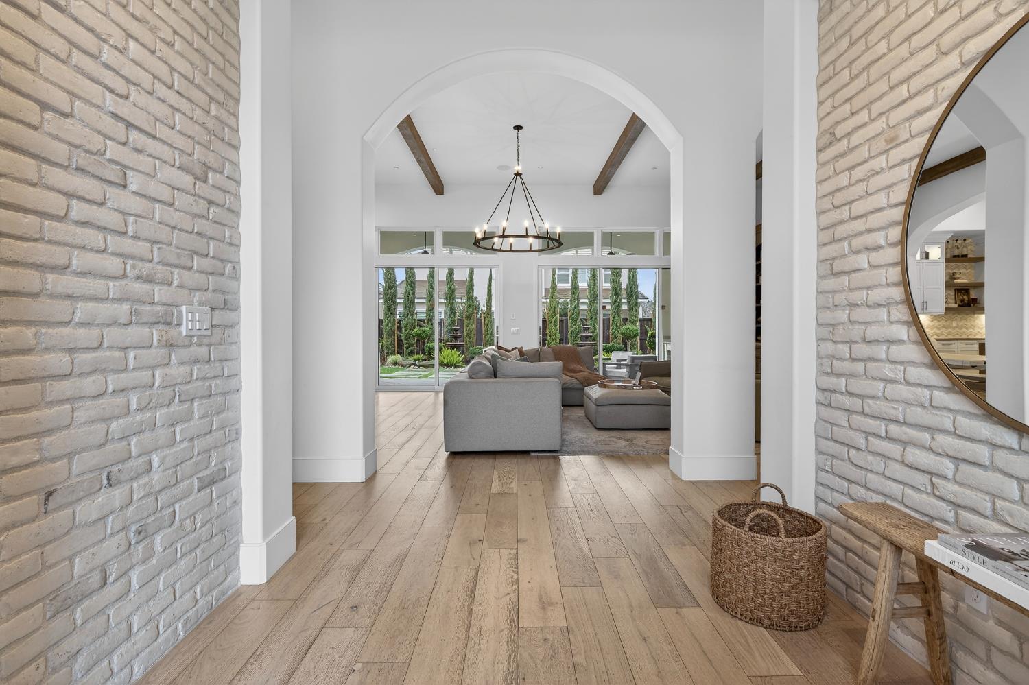61 Secret Court Lodi, CA 95242 - Photo 5 of 79 a living room with furniture and a chandelier