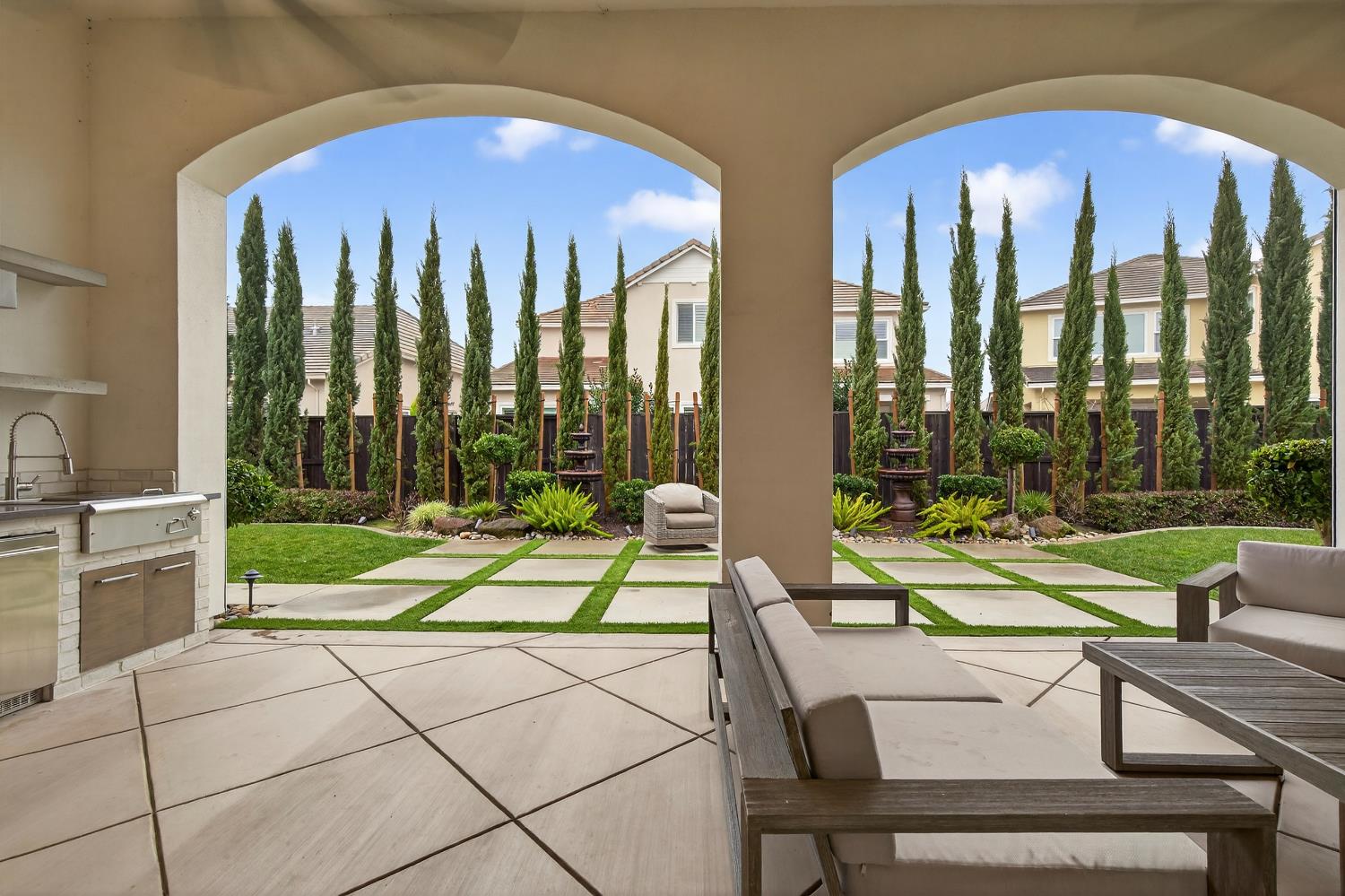61 Secret Court Lodi, CA 95242 - Photo 55 of 79 a view of swimming pool with a lounge chairs in front of a house