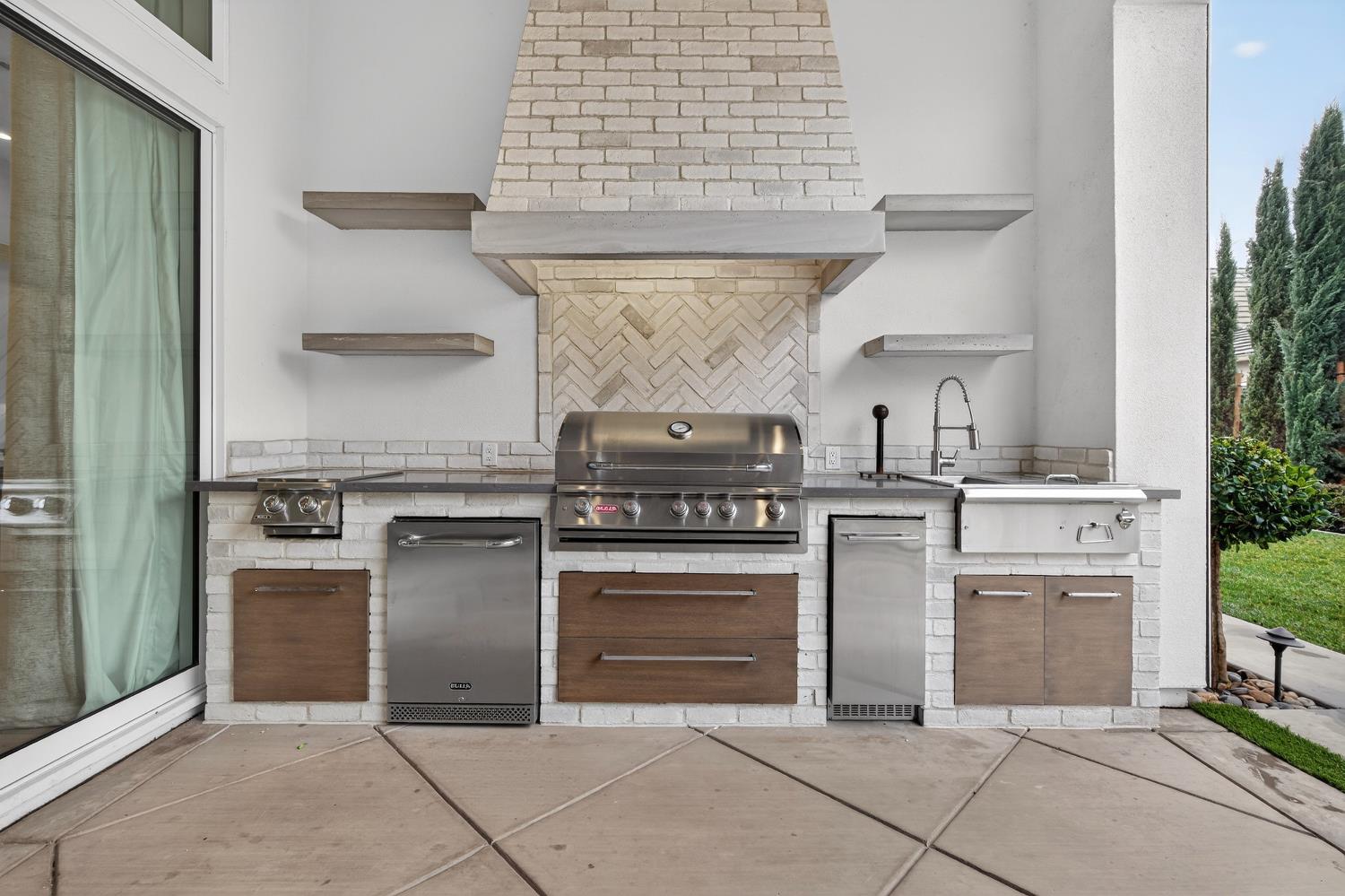 61 Secret Court Lodi, CA 95242 - Photo 56 of 79 a kitchen with white cabinets and appliances