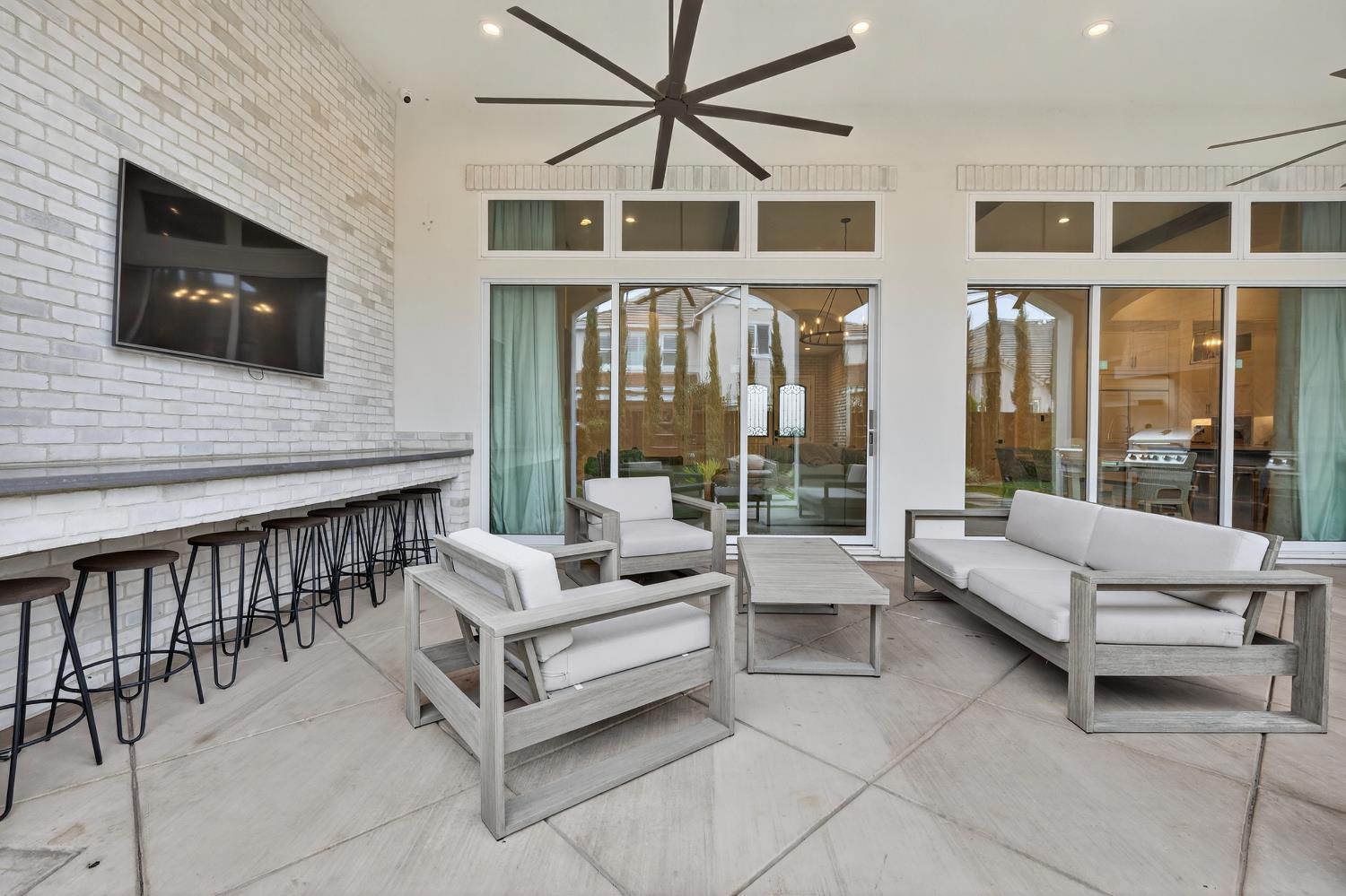 61 Secret Court Lodi, CA 95242 - Photo 59 of 79 a living room with furniture tv and a large window