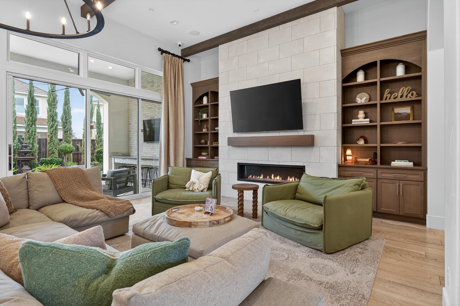 61 Secret Court Lodi, CA 95242 - Photo 6 of 79 a living room with furniture fireplace and flat screen tv