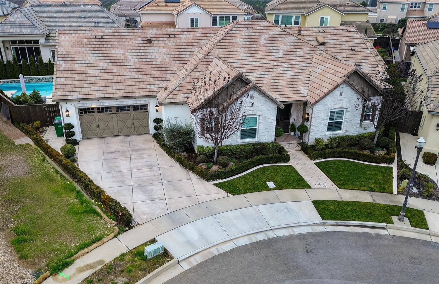 61 Secret Court Lodi, CA 95242 - Photo 73 of 79 a front view of a house with a yard