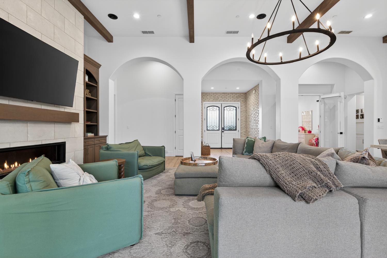 61 Secret Court Lodi, CA 95242 - Photo 8 of 79 a living room with furniture a flat screen tv and a fireplace