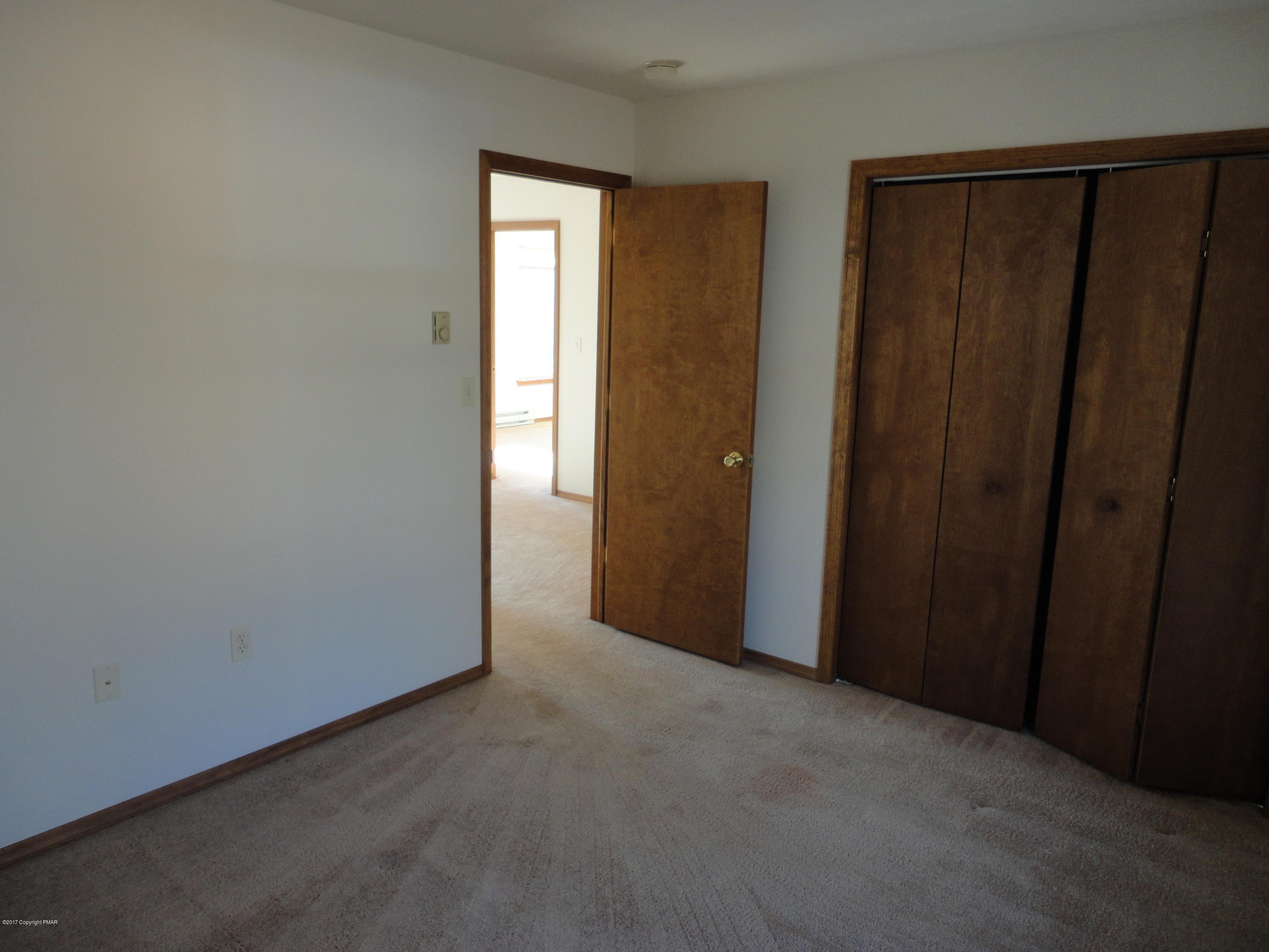 6389 Decker Road Bushkill, PA 18324 - Photo 16 of 22 a view of an empty room with wooden floor