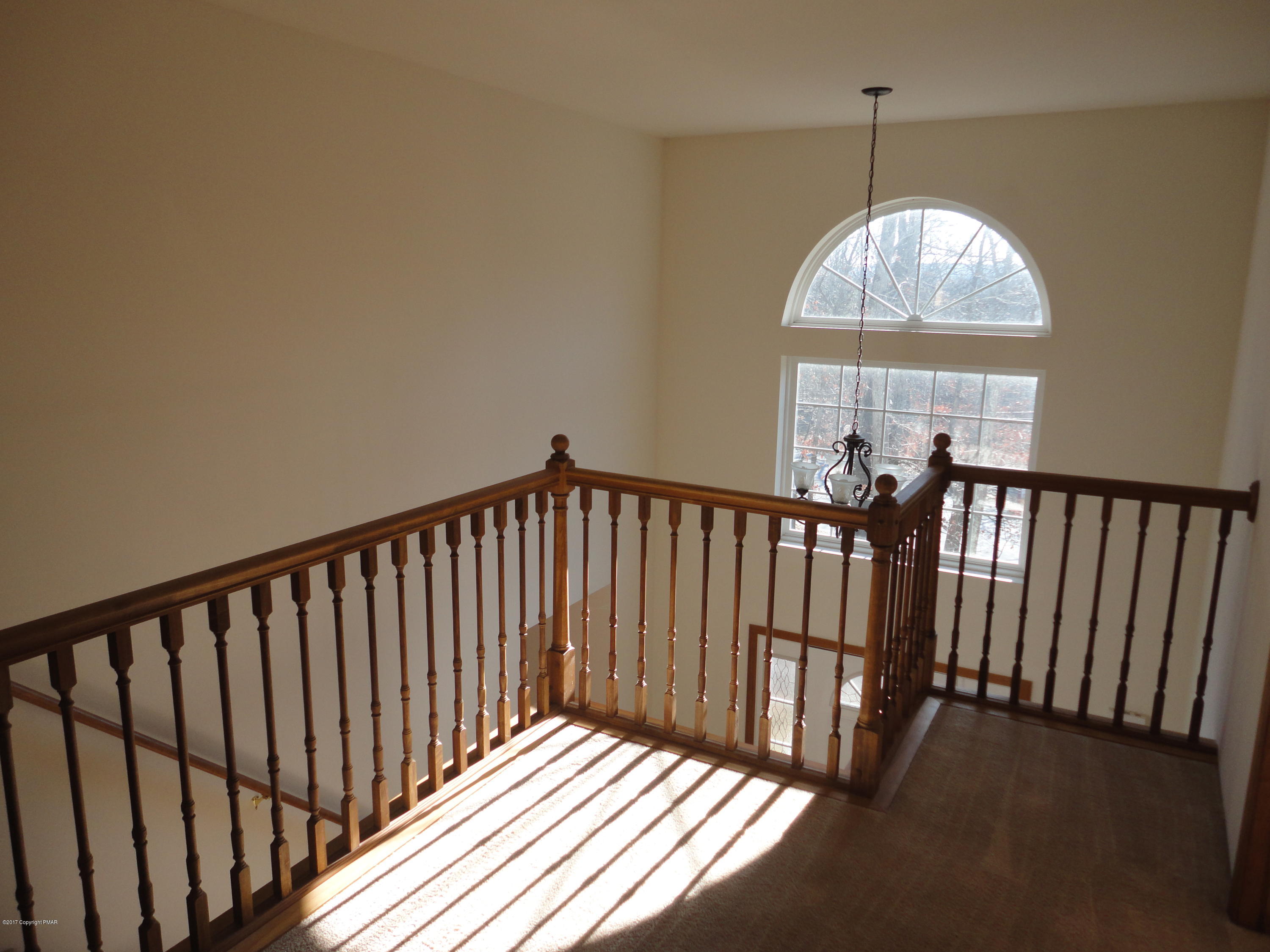 6389 Decker Road Bushkill, PA 18324 - Photo 17 of 22 a view of a balcony with a chandelier
