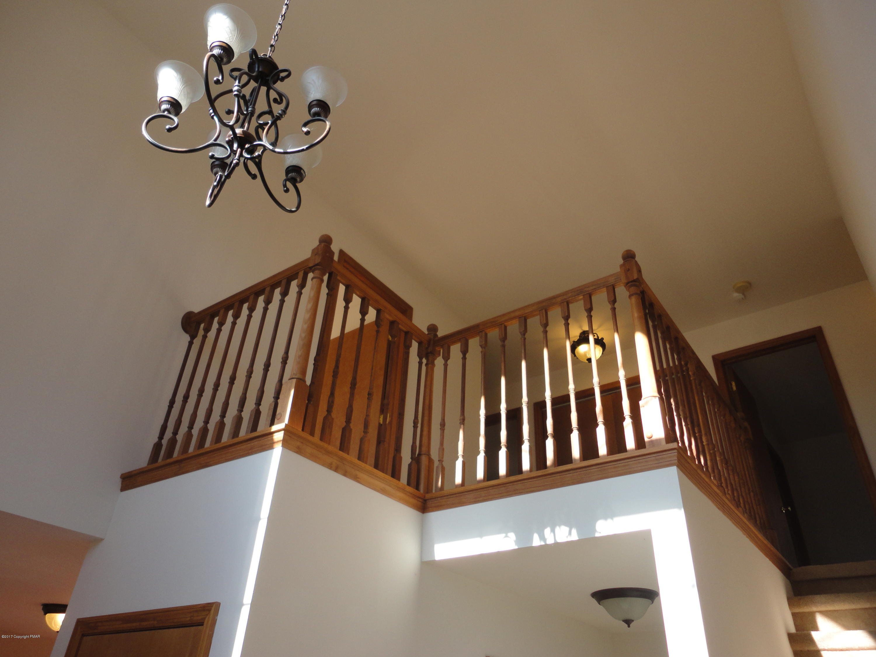 6389 Decker Road Bushkill, PA 18324 - Photo 6 of 22 a view of staircase with wooden floor