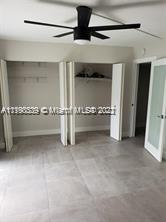 384 Mansfield I, Unit 384 Boca Raton, FL 33434 - Photo 8 of 9 a view of an empty room with a fireplace