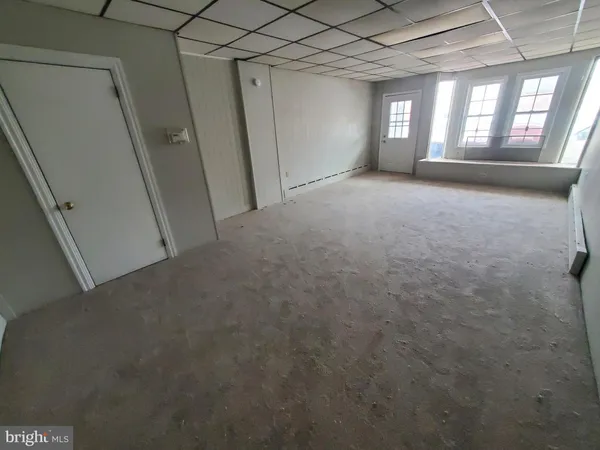 a view of empty room with windows