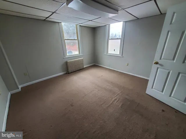 a view of empty room with windows