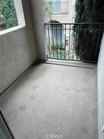 an empty room with wooden floor and closet