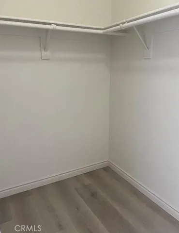 a view of an empty walk in closet
