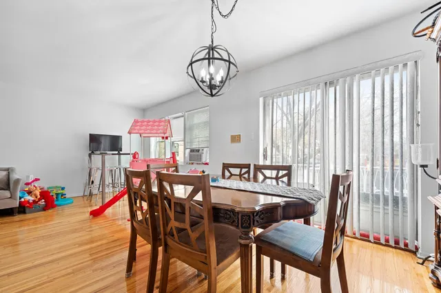 a view of a dining room with furniture and window