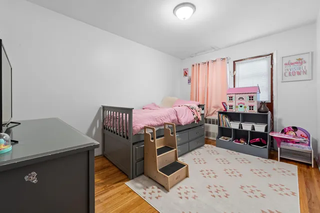 a bedroom with a bed and a desk