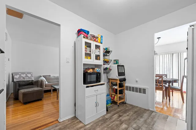 a bed room with a bed and a wooden floor