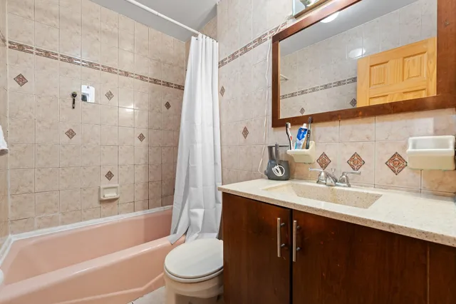 a bathroom with a sink a toilet and a bathtub