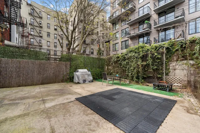 a view of a building with a yard