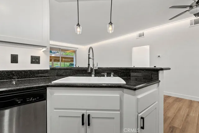 a kitchen with a sink and a stove