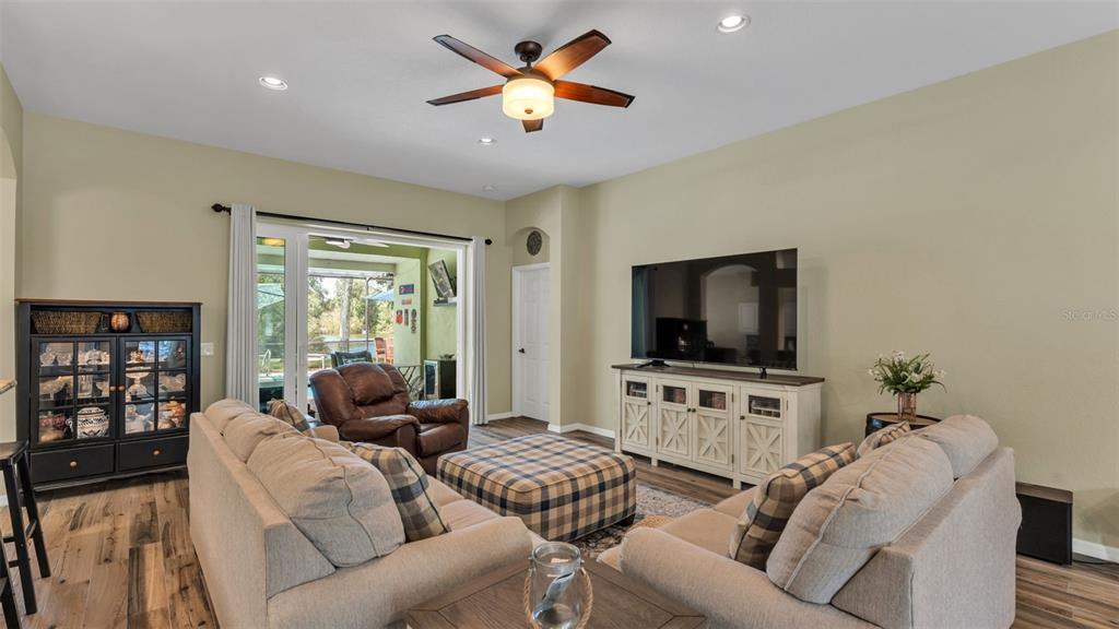 2803 Spring Meadow Drive Plant City, FL 33566 - Photo 12 of 74 a living room with furniture and a flat screen tv