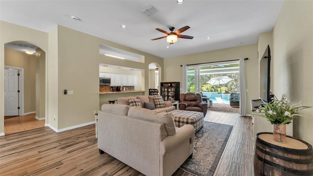 2803 Spring Meadow Drive Plant City, FL 33566 - Photo 14 of 74 a living room with furniture potted plant and a chandelier