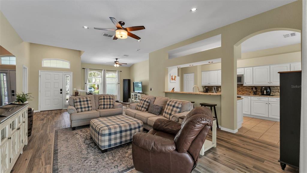 2803 Spring Meadow Drive Plant City, FL 33566 - Photo 15 of 74 a living room with furniture ceiling fan and a rug
