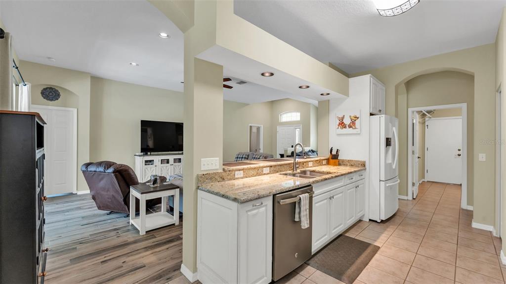 2803 Spring Meadow Drive Plant City, FL 33566 - Photo 18 of 74 a kitchen with a stove and a refrigerator