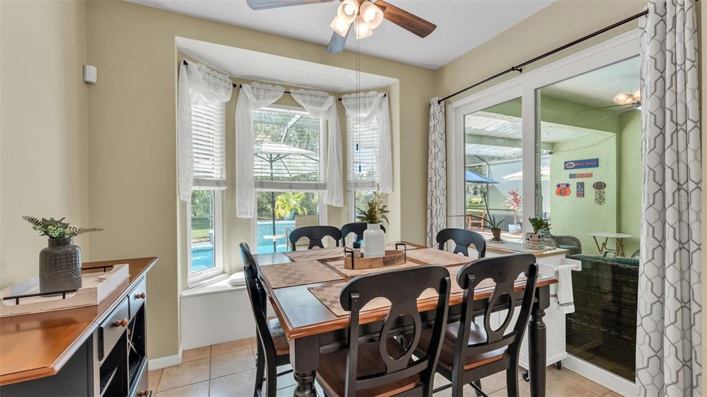 2803 Spring Meadow Drive Plant City, FL 33566 - Photo 22 of 74 a view of a dining room with furniture window and outside view