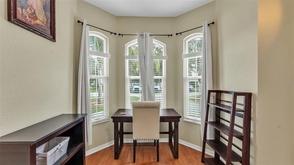 2803 Spring Meadow Drive Plant City, FL 33566 - Photo 25 of 74 a view of a dining room with furniture and a window