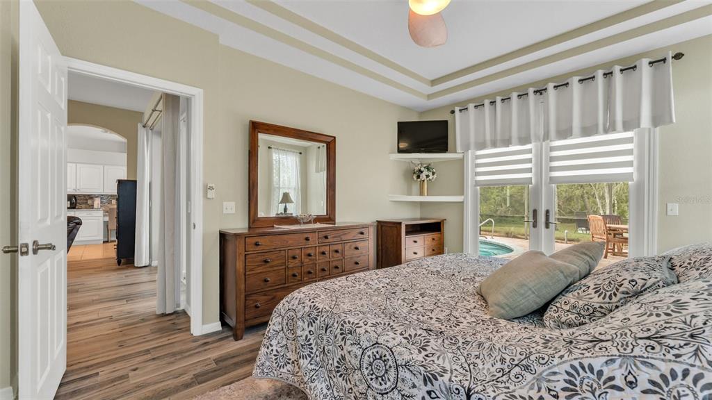 2803 Spring Meadow Drive Plant City, FL 33566 - Photo 29 of 74 a bedroom with a bed and a large window with balcony view
