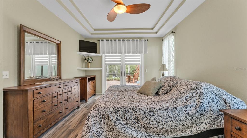 2803 Spring Meadow Drive Plant City, FL 33566 - Photo 30 of 74 a bedroom with a bed and a fireplace