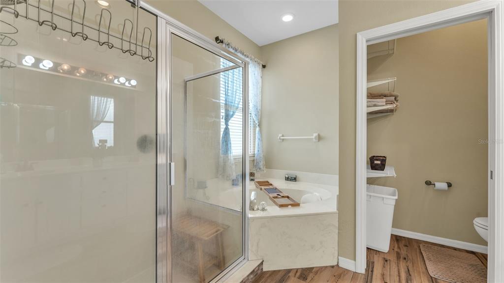 2803 Spring Meadow Drive Plant City, FL 33566 - Photo 34 of 74 a bathroom with a glass shower door and a sink