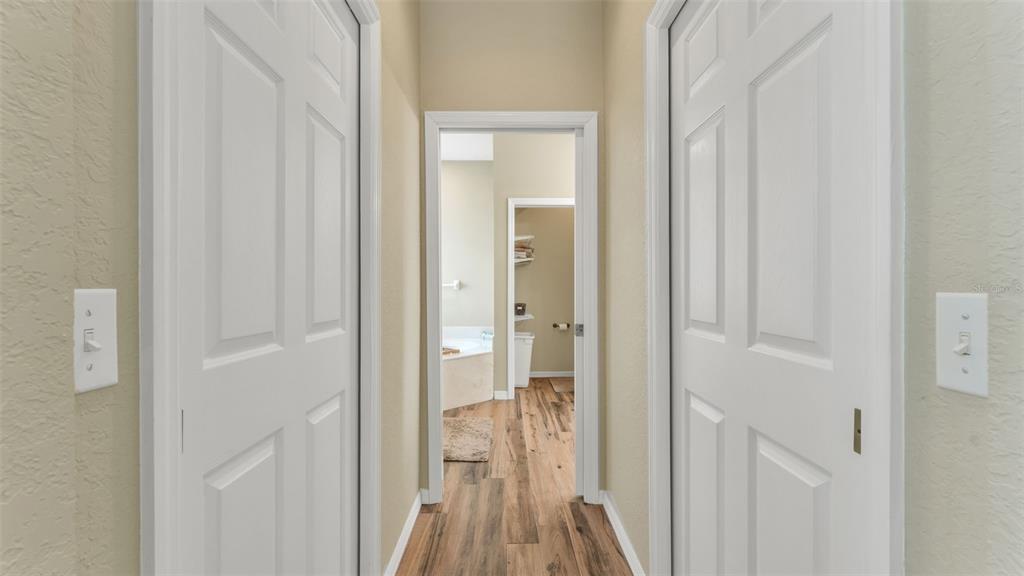 2803 Spring Meadow Drive Plant City, FL 33566 - Photo 35 of 74 a view of a hallway with a wooden door