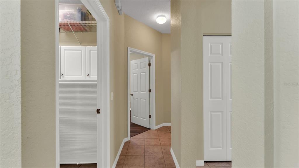 2803 Spring Meadow Drive Plant City, FL 33566 - Photo 36 of 74 a view of a hallway with wooden floor
