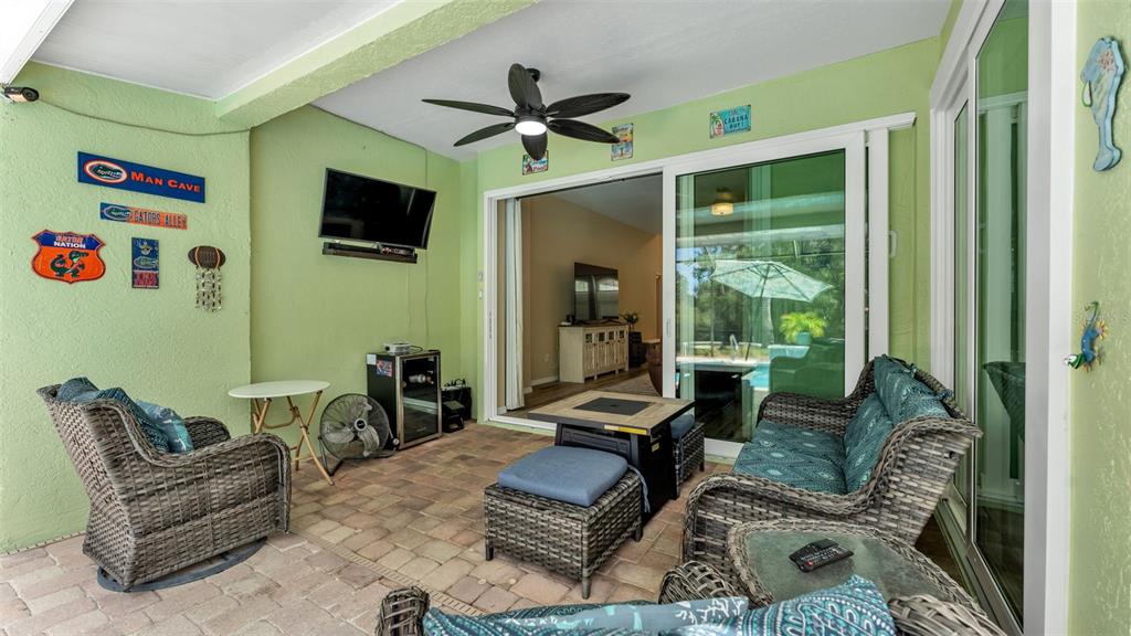 2803 Spring Meadow Drive Plant City, FL 33566 - Photo 49 of 74 a living room with furniture a flat screen tv and a large window
