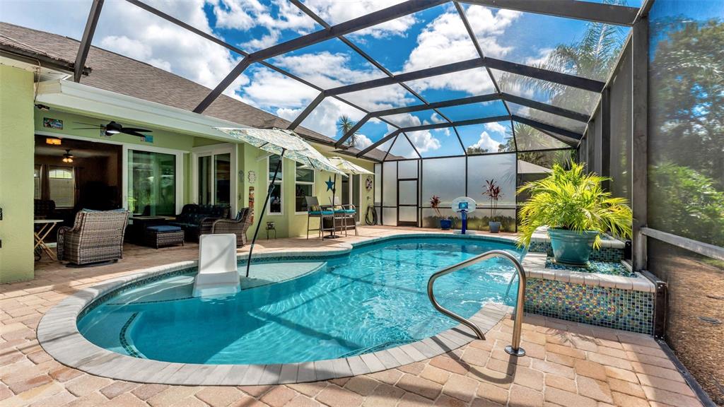 2803 Spring Meadow Drive Plant City, FL 33566 - Photo 55 of 74 a view of a swimming pool with sitting area