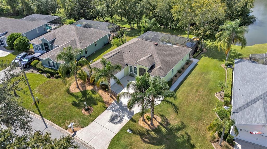 2803 Spring Meadow Drive Plant City, FL 33566 - Photo 71 of 74 an aerial view of a house with a yard and plants