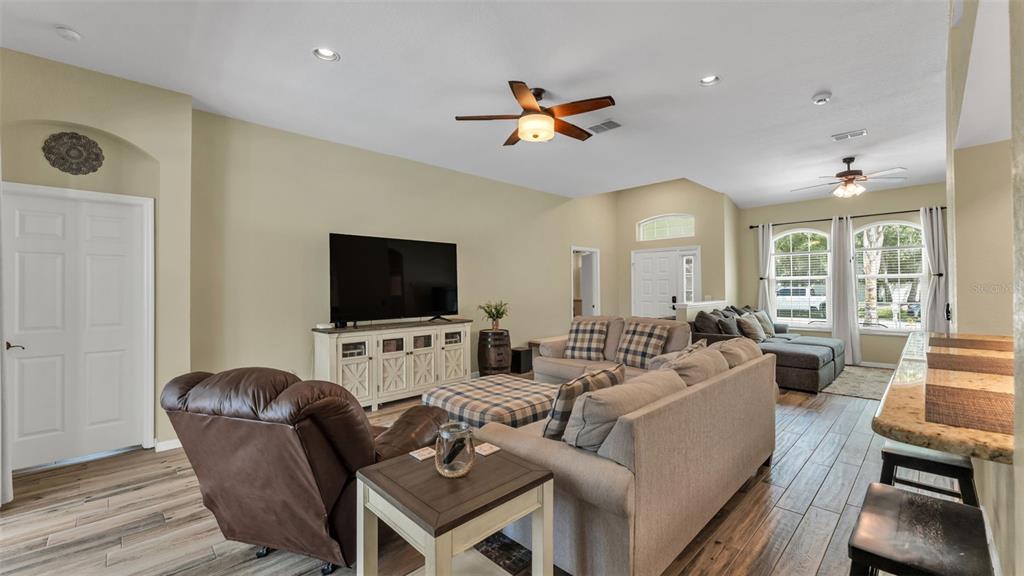 2803 Spring Meadow Drive Plant City, FL 33566 - Photo 8 of 74 a living room with furniture and a flat screen tv
