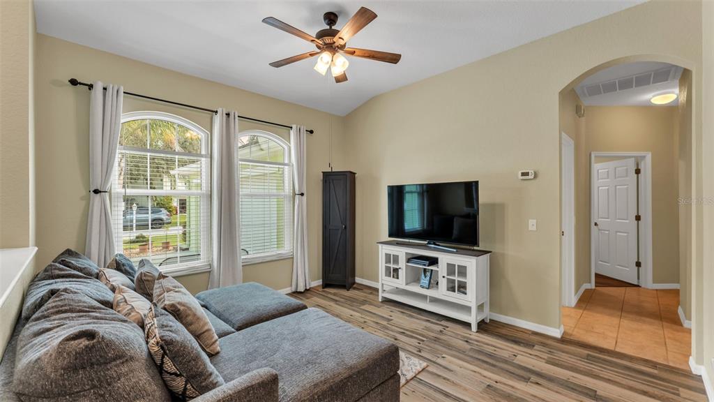 2803 Spring Meadow Drive Plant City, FL 33566 - Photo 10 of 74 a living room with furniture and a flat screen tv