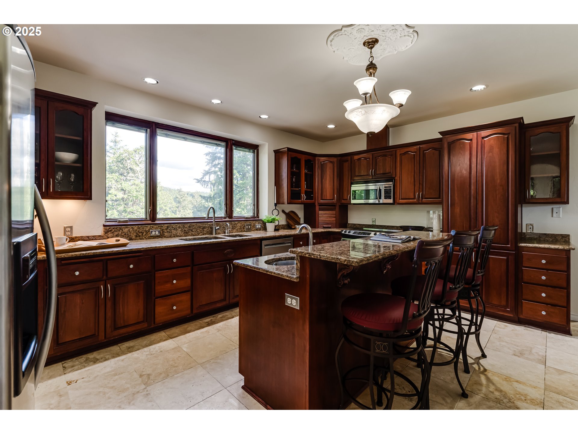 27161 Briggs Hill Road Eugene, OR 97405 - Photo 15 of 47 a kitchen with granite countertop a sink and a refrigerator