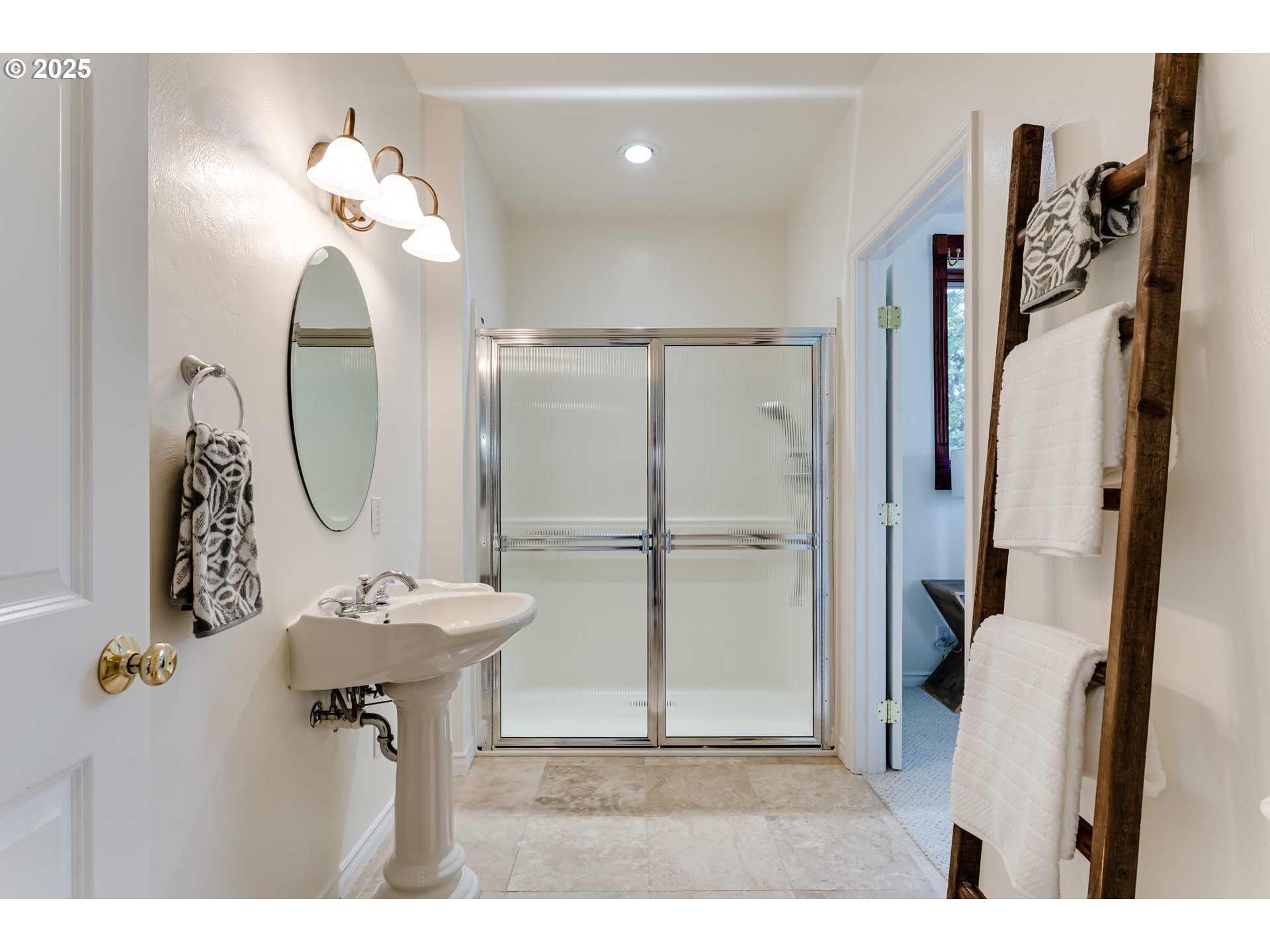 27161 Briggs Hill Road Eugene, OR 97405 - Photo 21 of 47 a bathroom with a sink a mirror and a shower
